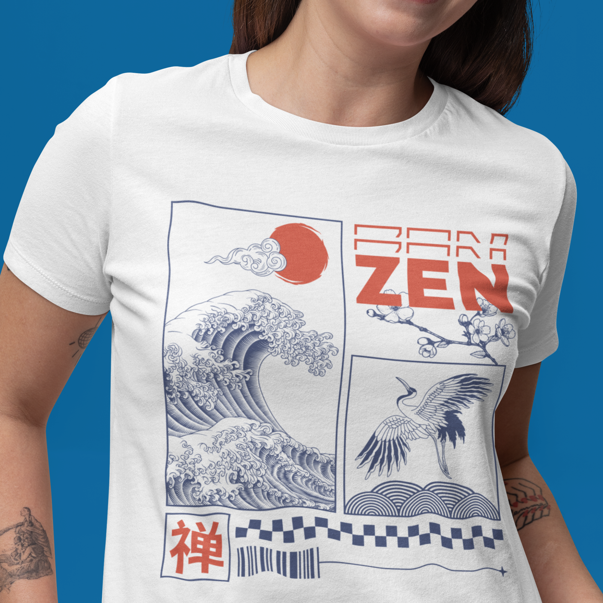 Trendy Japanese streetwear Zen T-shirt with wave and crane design, worn by woman against blue background.