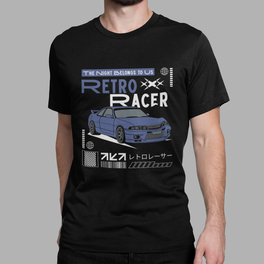 Trendy black graphic T-shirt featuring retro Japanese sports car artwork and racer typography, modeled by man.