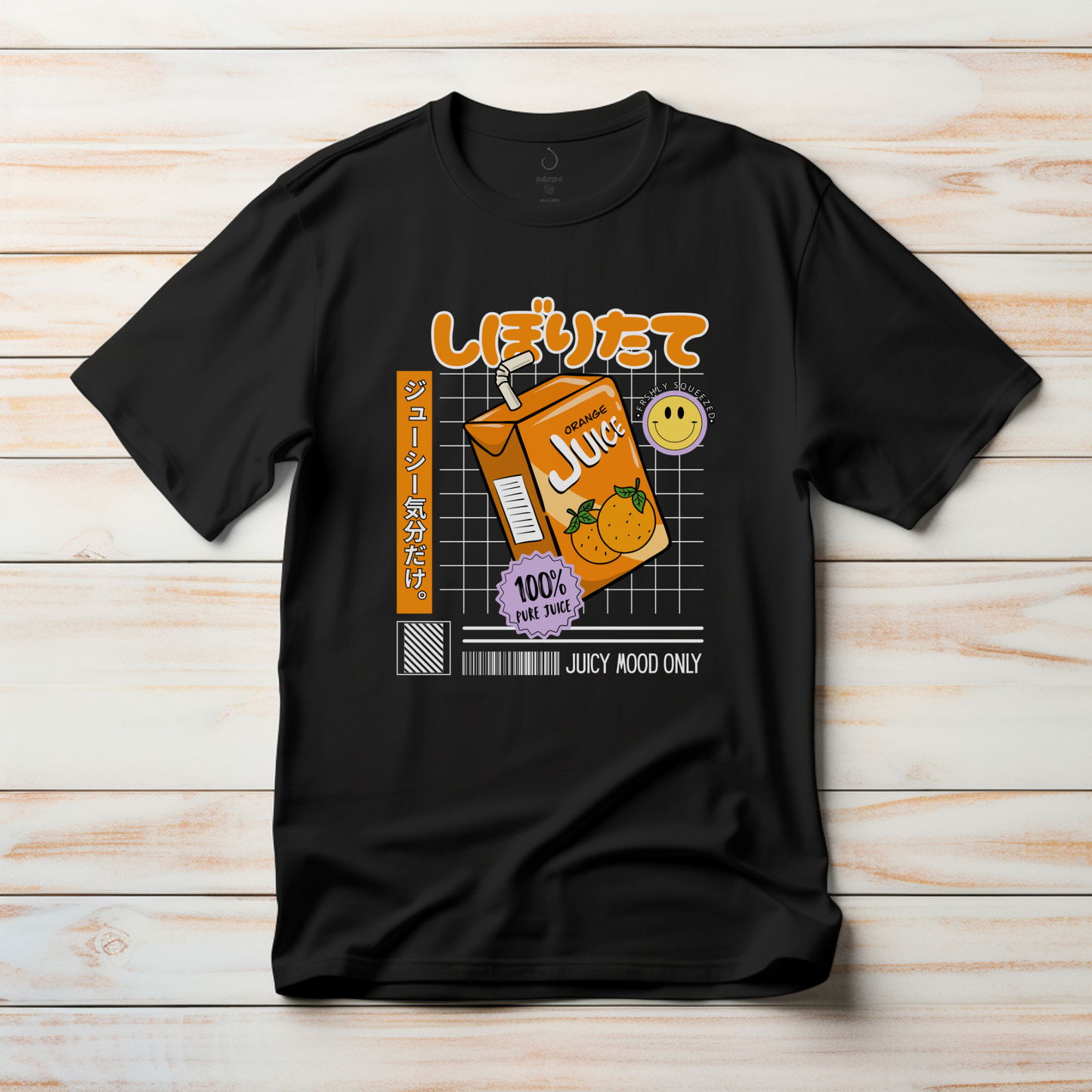 Black t-shirt with a juice carton graphic and text on a wooden surface