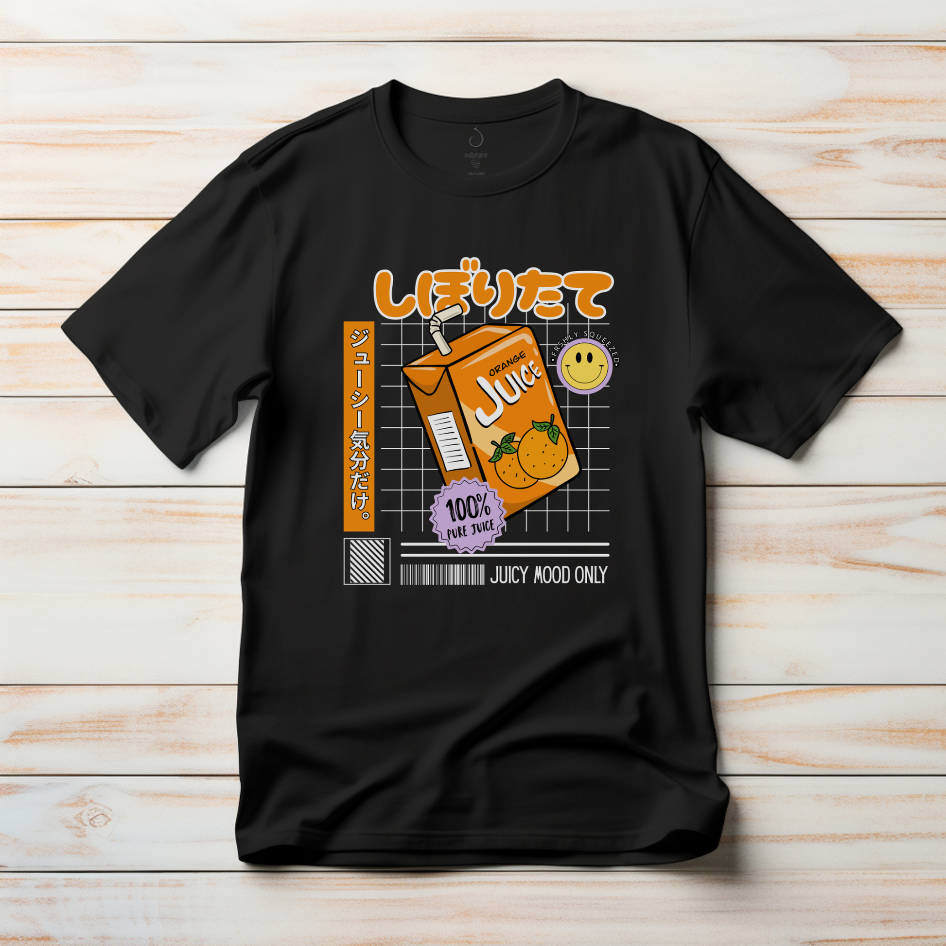 Black t-shirt with a juice carton graphic and text on a wooden surface